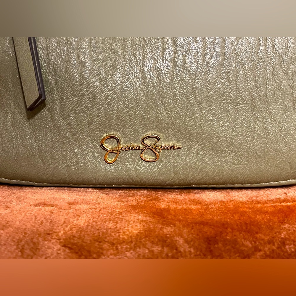 Jessica Simpson NWOT sage green crossbody strap animal print lining gold accents